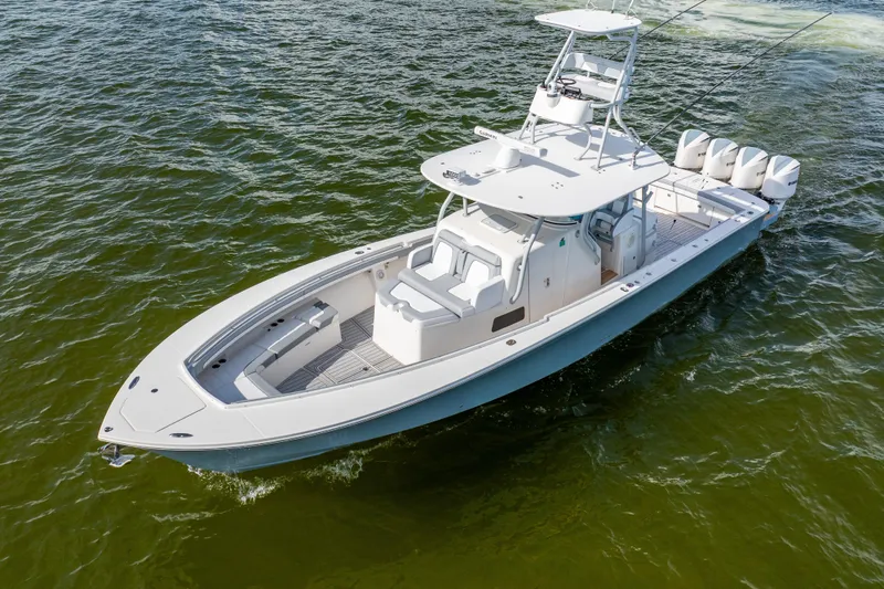  Yacht Photos Pics 2018 Regulator 41 boat on water, featuring sleek design and multiple outboard engines.