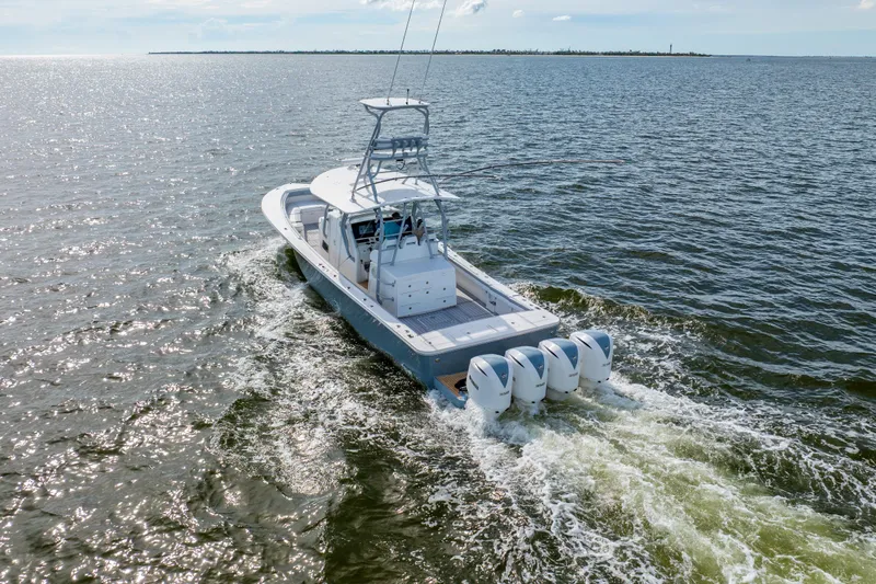  Yacht Photos Pics 2018 Regulator 41 boat cruising on open water with four engines.