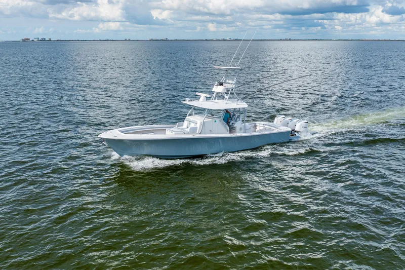  Yacht Photos Pics 2018 Regulator 41 boat cruising on open water under cloudy skies.