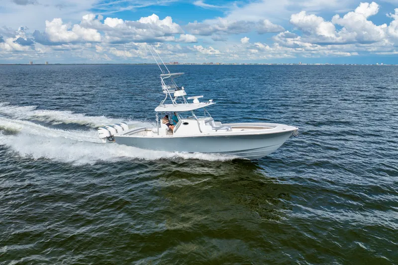 Yacht Photos Pics 2018 Regulator 41 boat cruising on open water under a partly cloudy sky.