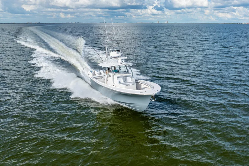  Yacht Photos Pics 2018 Regulator 41 boat cruising on open water under a partly cloudy sky.