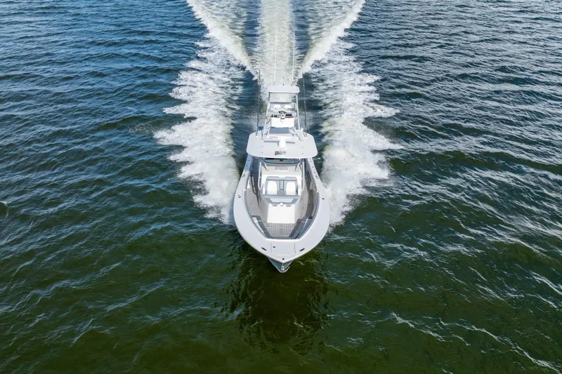  Yacht Photos Pics 2018 Regulator 41 boat cruising on open water, aerial view.