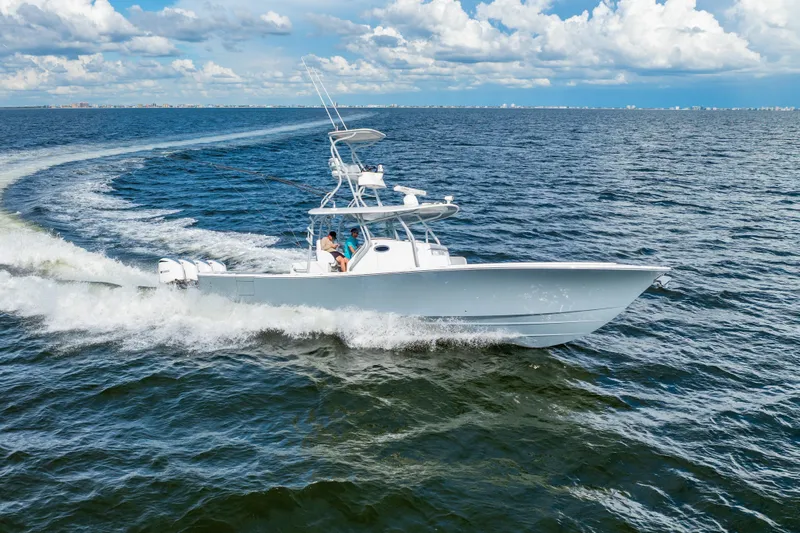  Yacht Photos Pics 2018 Regulator 41 boat cruising on open water under a partly cloudy sky.