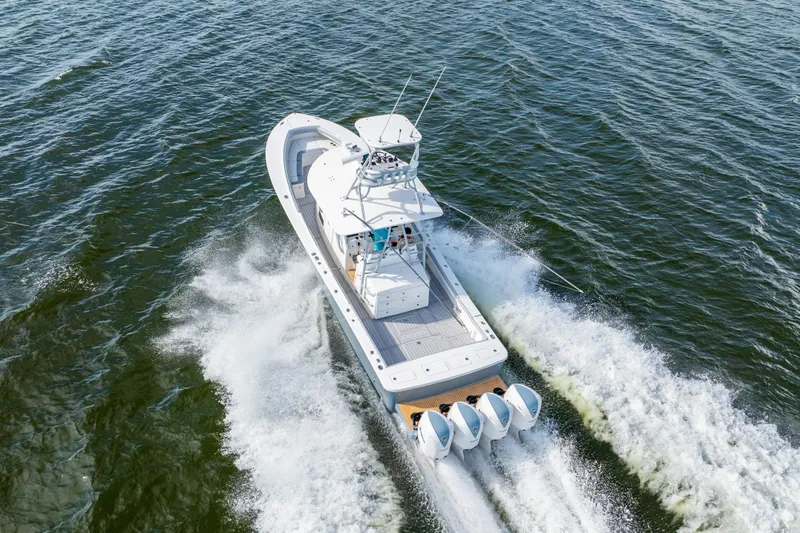  Yacht Photos Pics Aerial view of 2018 Regulator 41 boat cruising on open water.
