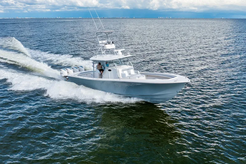  Yacht Photos Pics 2018 Regulator 41 boat cruising on open water under a cloudy sky.