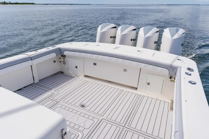  Yacht Photos Pics 2018 Regulator 41 boat deck with four Yamaha outboard engines on calm water.