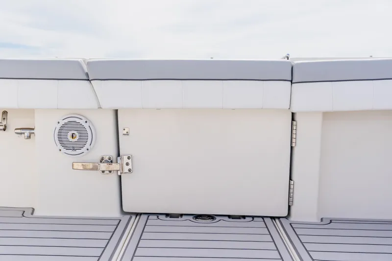  Yacht Photos Pics 2018 Regulator 41 boat interior with cushioned seating and speaker detail.