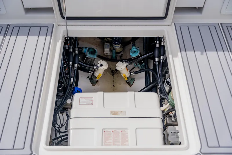  Yacht Photos Pics Engine compartment of a 2018 Regulator 41 boat, showcasing mechanical components and wiring.