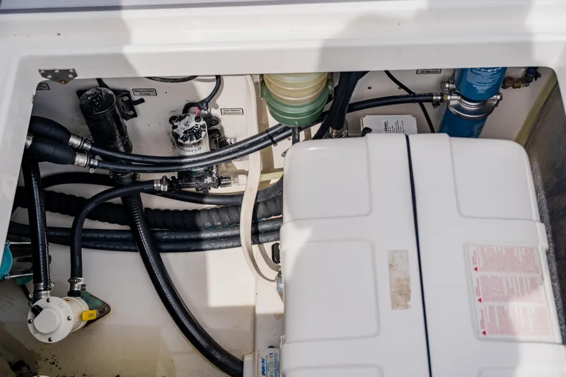  Yacht Photos Pics Engine compartment of a 2018 Regulator 41 boat, showcasing hoses and components.
