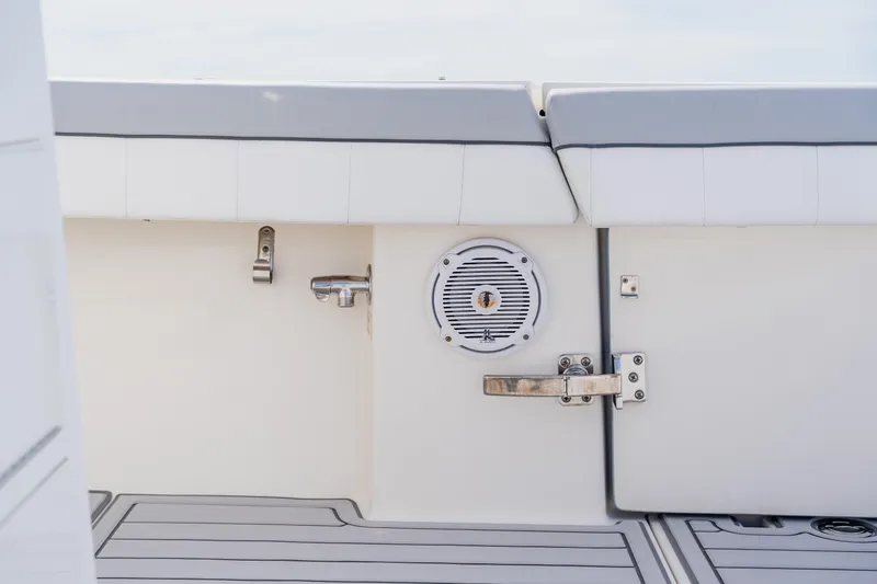  Yacht Photos Pics 2018 Regulator 41 boat interior with speaker and latch on white panel.