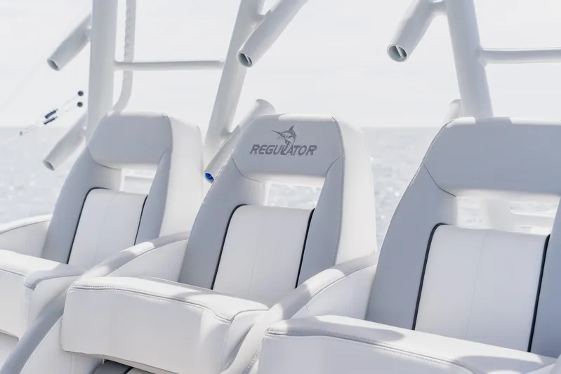  Yacht Photos Pics Luxury seating on 2018 Regulator 41 boat, featuring sleek white design and logo.