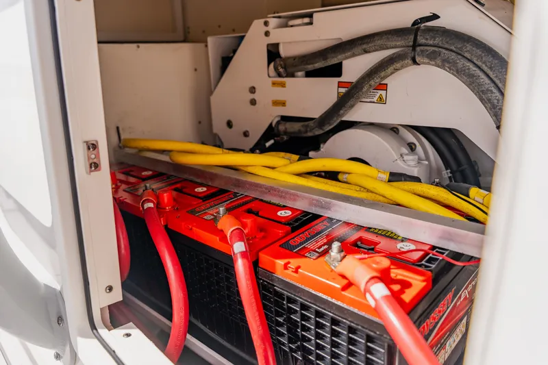  Yacht Photos Pics Battery compartment of a 2018 Regulator 41 boat with cables and equipment.