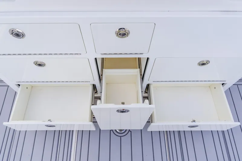  Yacht Photos Pics Open storage drawers on a 2018 Regulator 41 boat, showcasing ample space and sleek design.