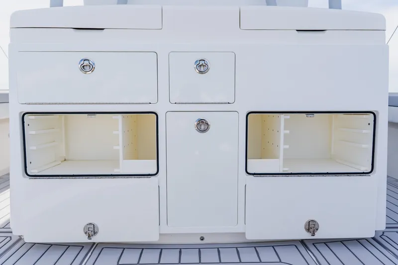  Yacht Photos Pics 2018 Regulator 41 boat storage compartments with open doors on deck.