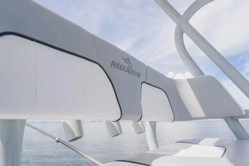  Yacht Photos Pics 2018 Regulator 41 boat seating detail with logo, ocean background.