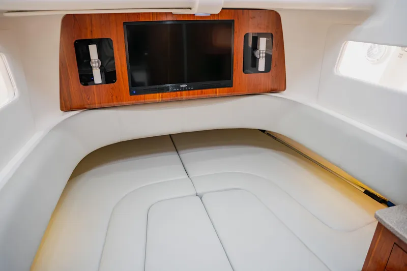  Yacht Photos Pics 2018 Regulator 41 cabin interior with TV and white seating.