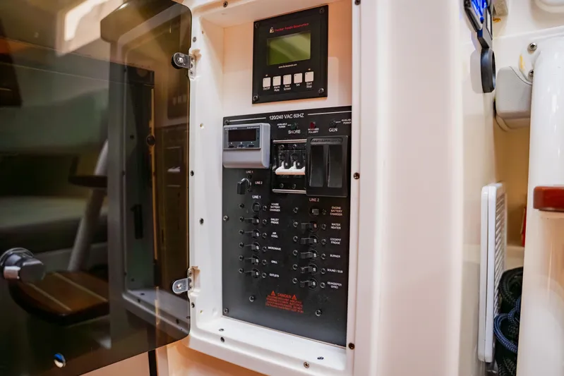  Yacht Photos Pics Electrical panel inside a 2018 Regulator 41 boat, showcasing switches and controls.