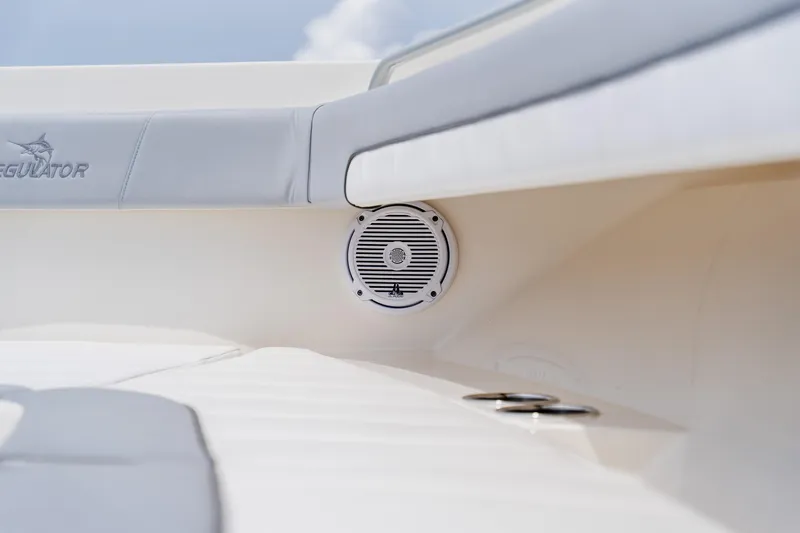  Yacht Photos Pics 2018 Regulator 41 boat interior with speaker and cushioned seating.