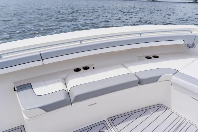  Yacht Photos Pics 2018 Regulator 41 boat seating area with cup holders, on calm water.