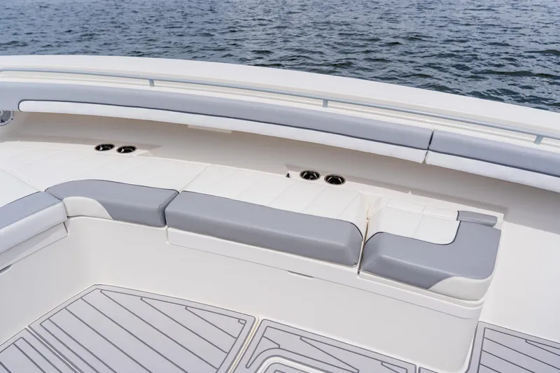  Yacht Photos Pics 2018 Regulator 41 boat interior with cushioned seating and ocean view.