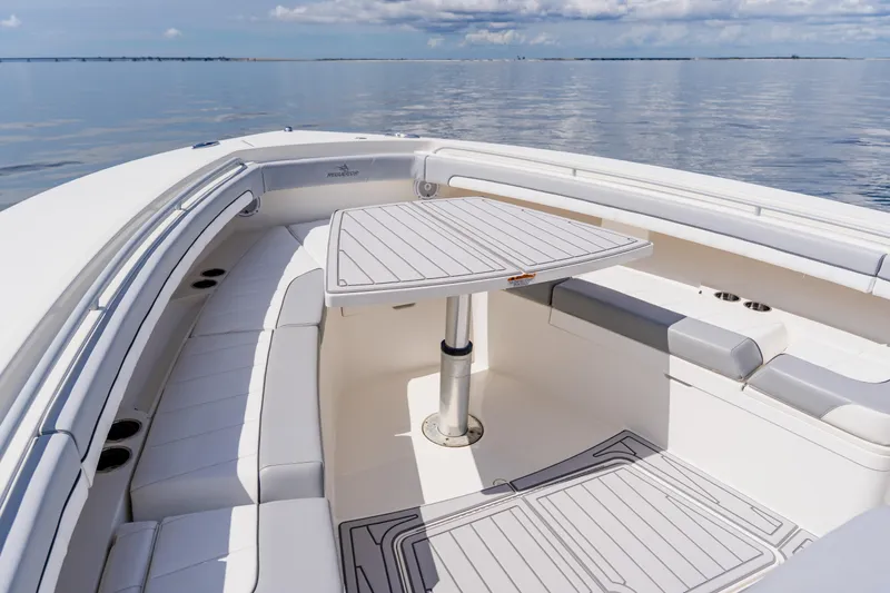  Yacht Photos Pics Luxurious 2018 Regulator 41 boat interior with seating and table on calm water.