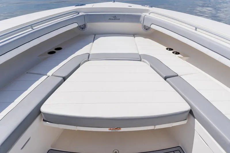  Yacht Photos Pics 2018 Regulator 41 boat interior with cushioned seating and sleek design.
