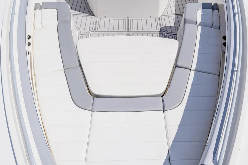  Yacht Photos Pics Spacious seating area on 2018 Regulator 41 boat, featuring white and gray cushions.