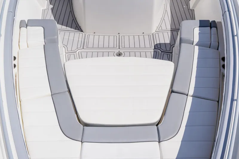  Yacht Photos Pics 2018 Regulator 41 boat interior with white cushioned seating and sleek design.