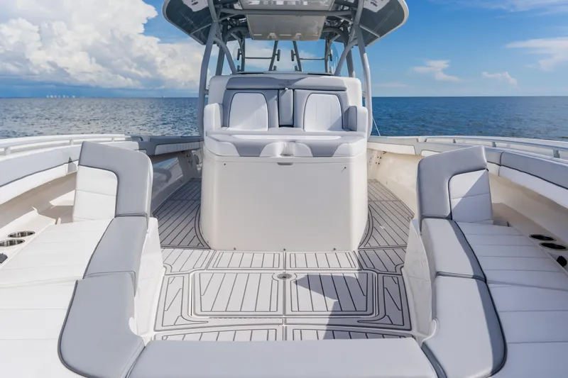  Yacht Photos Pics 2018 Regulator 41 boat interior with spacious seating, ocean backdrop, and clear skies.