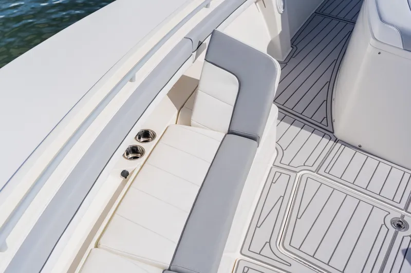  Yacht Photos Pics 2018 Regulator 41 boat interior with cushioned seating and sleek flooring design.