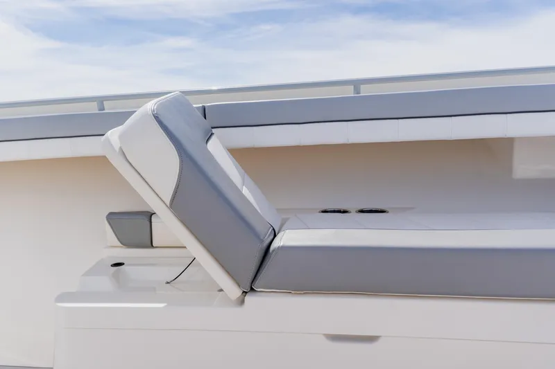  Yacht Photos Pics 2018 Regulator 41 boat with cushioned seating and sleek design.