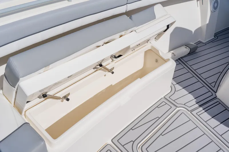  Yacht Photos Pics Open storage compartment on 2018 Regulator 41 boat with cushioned seating.