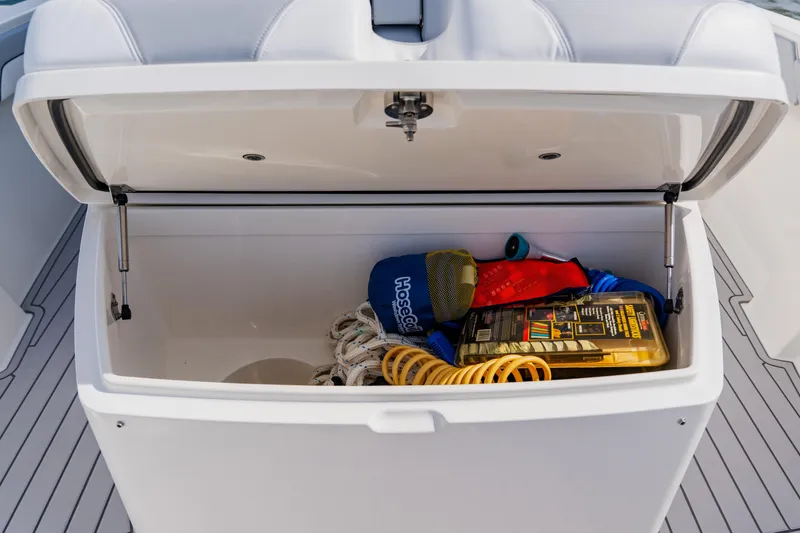  Yacht Photos Pics Open storage compartment on 2018 Regulator 41 boat with various boating accessories.