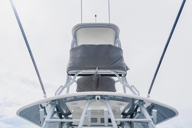  Yacht Photos Pics 2018 Regulator 41 boat tower with covered seating against a cloudy sky.