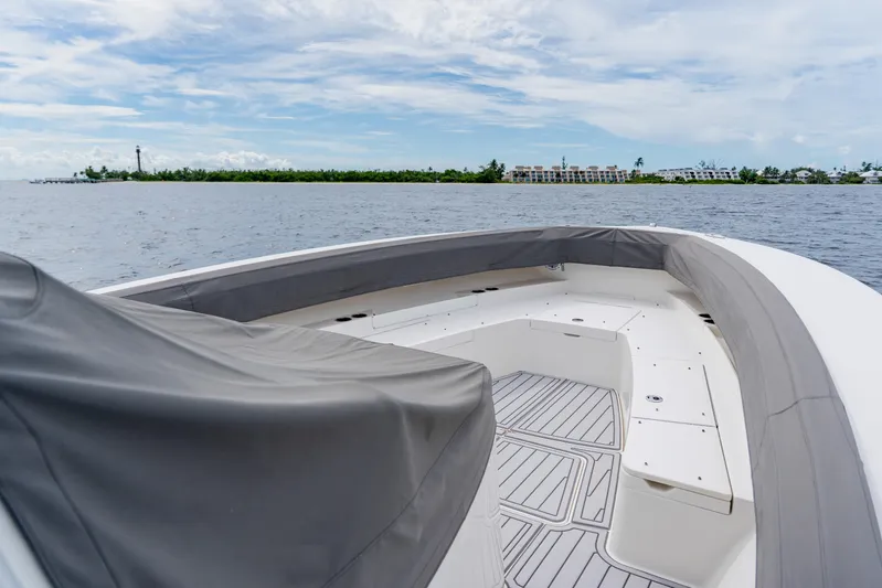  Yacht Photos Pics 2018 Regulator 41 boat with spacious deck, scenic waterfront view.