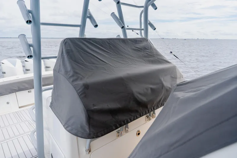  Yacht Photos Pics 2018 Regulator 41 boat with covered console, ocean backdrop.