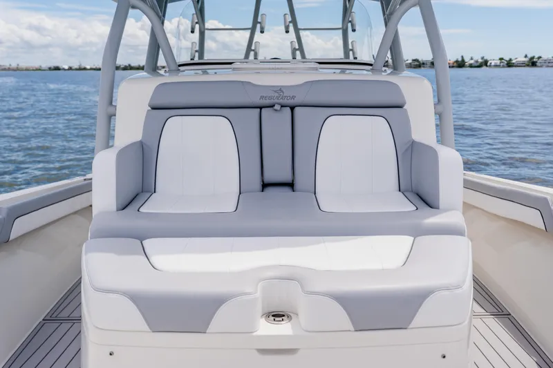  Yacht Photos Pics 2018 Regulator 41 boat seating with ocean view, featuring sleek white and gray upholstery.