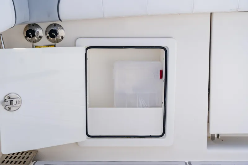  Yacht Photos Pics Open storage compartment on 2018 Regulator 41 boat, featuring secure latch and clean design.