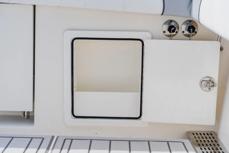 Yacht Photos Pics 2018 Regulator 41 boat storage compartment with open hatch and secure latch.