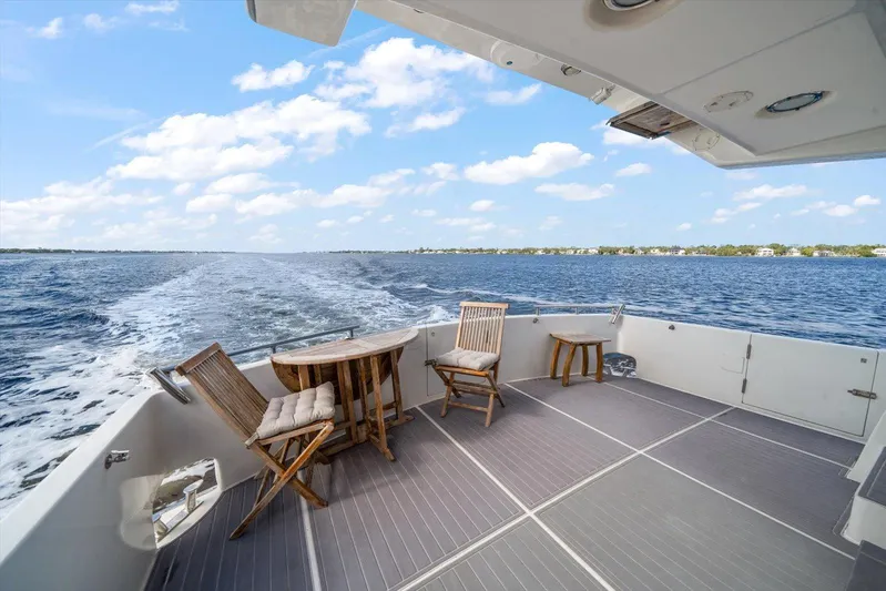  Yacht Photos Pics Spacious deck of 1996 Johnson High Tech Euro Motoryacht cruising on open water.