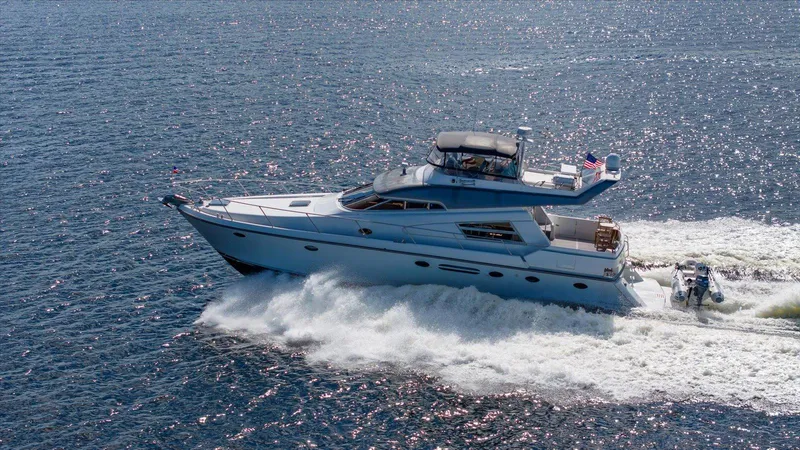  Yacht Photos Pics Johnson High Tech Euro Motoryacht 1996 cruising on open water.