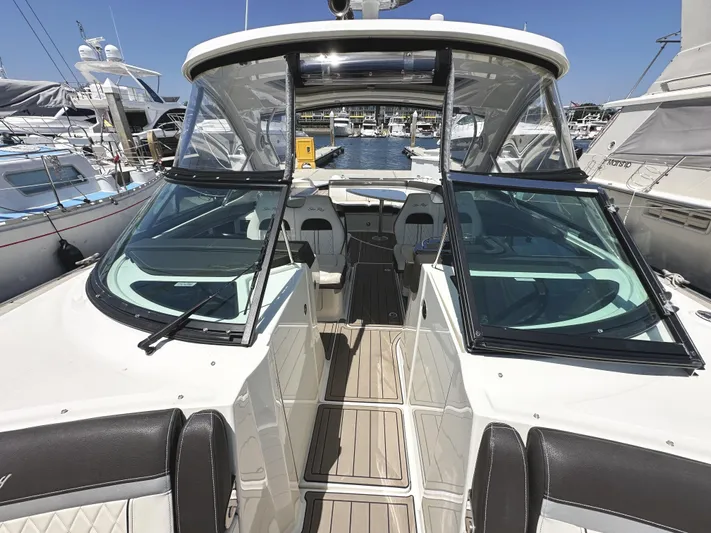 Knot About You Yacht Photos Pics 2017 Sea Ray SLX 350 boat interior with open deck and seating at marina.