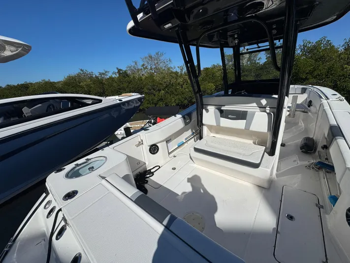  Yacht Photos Pics 2023 Robalo R270 Center Console boat interior with seating and storage.