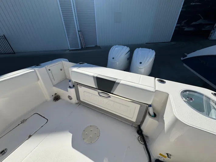  Yacht Photos Pics 2023 Robalo R270 Center Console boat interior with dual engines and seating area.