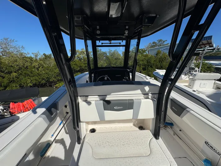  Yacht Photos Pics 2023 Robalo R270 Center Console boat interior with seating and console view.