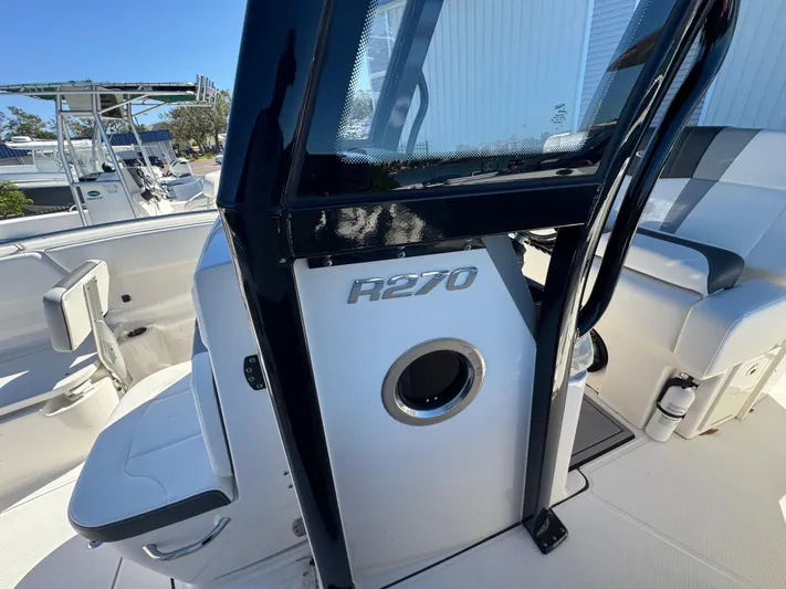  Yacht Photos Pics 2023 Robalo R270 Center Console boat interior, featuring sleek seating and modern design.