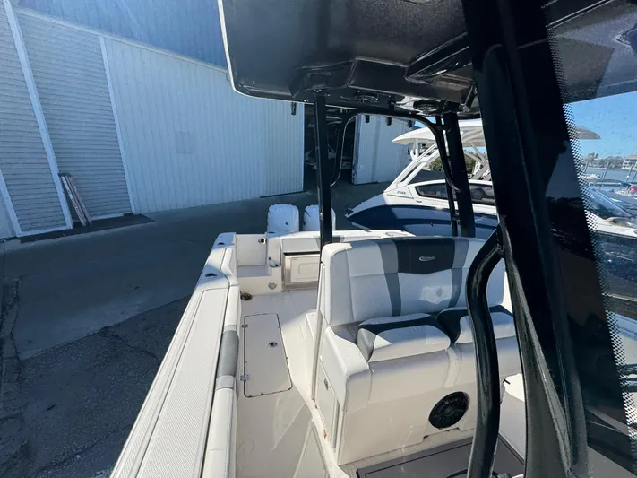  Yacht Photos Pics 2023 Robalo R270 Center Console boat interior with seating and console view.