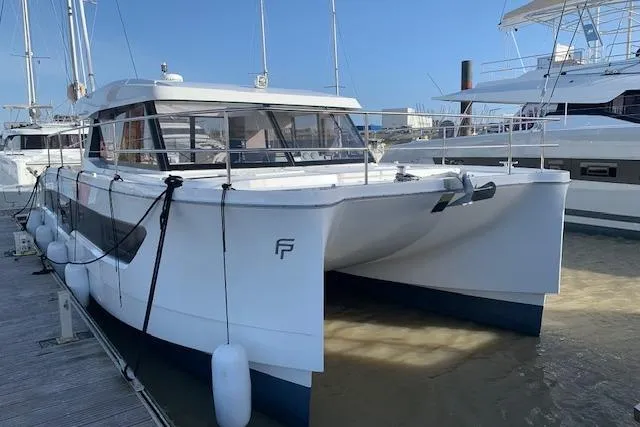 Cat&go Yacht Photos Pics 2025 Fountaine Pajot MY4.S catamaran docked at marina, showcasing sleek design and modern features.