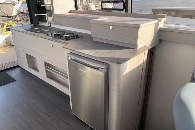 Cat&go Yacht Photos Pics Modern kitchen area in 2025 Fountaine Pajot MY4.S yacht with sleek appliances.