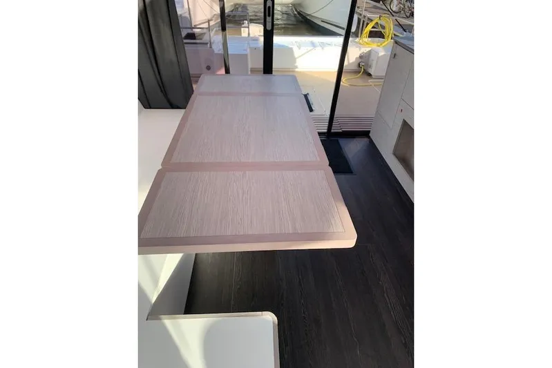 Cat&go Yacht Photos Pics Interior of 2025 Fountaine Pajot MY4.S yacht with elegant wooden table.